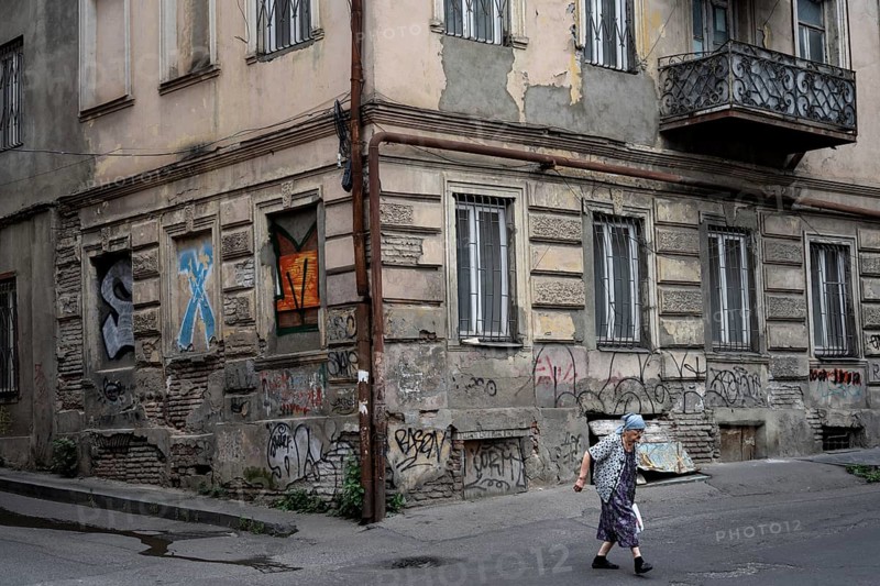 Tbilisi, Georgia. July 15th 2025. An elderly Georgian lady crossing the street in the downtown neighborhood of Old Tbilisi, Georgia