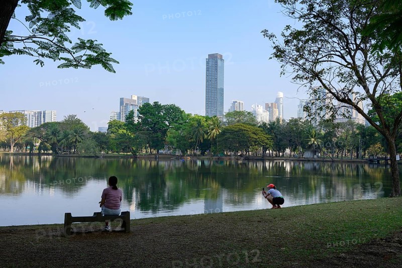Bangkok, Thailand. March 4th 2025. People enjoy the calm and peaceful green environment beside the lake in Lumphini Park, Bangkok