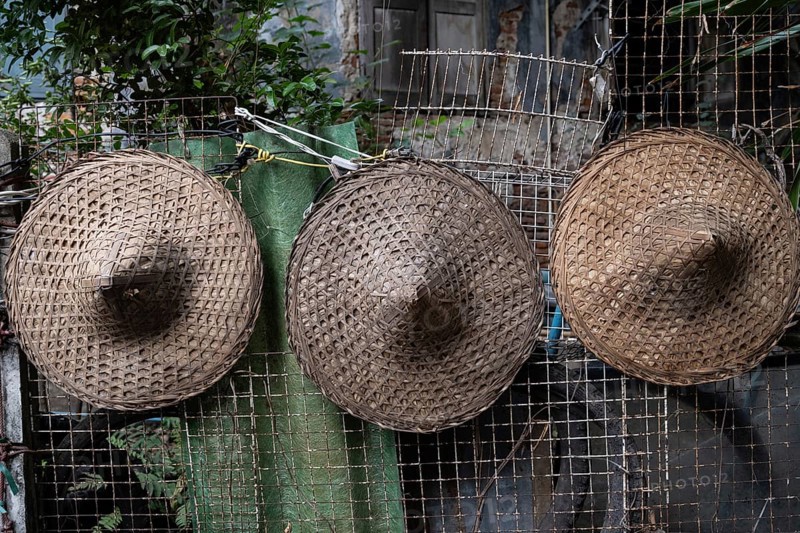 Traditional hats being used a street decoration in the Talat Noi neighbourhood of Bangkok, Thailand, Asia