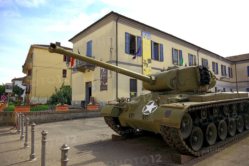 Italy, village of Brescello, film prop of restored M26 Pershing tanks in front of the museum of Don Camillo and Peppone, Emilia-Romagna