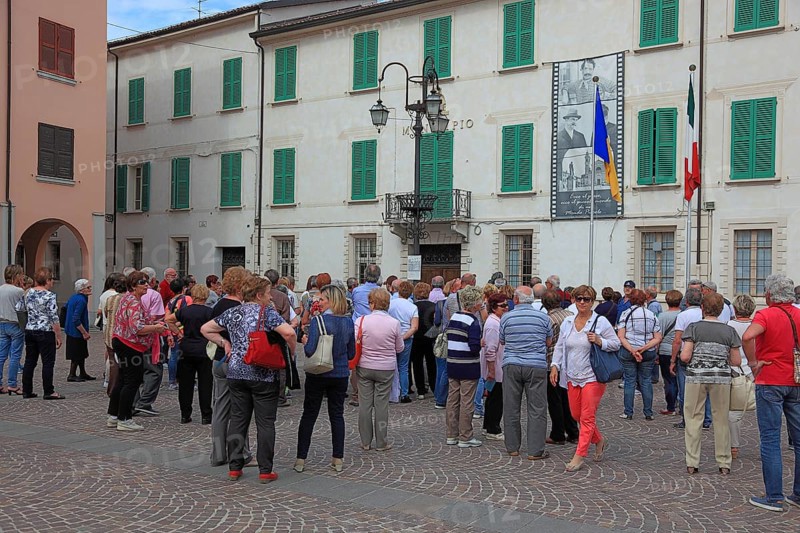 Group of visitors in the town of Don Camillo and Peppone, Brescello, Emilia-Romagna, Italy