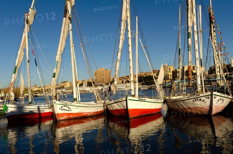 Aswan, Egypt. January 12th 2013 Beautiful painted Egyptian Felucca sail boats moored at Elephantine Island, River Nile, Aswan, Egypt