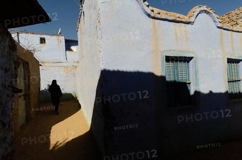 Aswan, Egypt. January 11th 2013 Bright blue traditional Nubian houses in the West bank Nile village at Aswan Upper Egypt