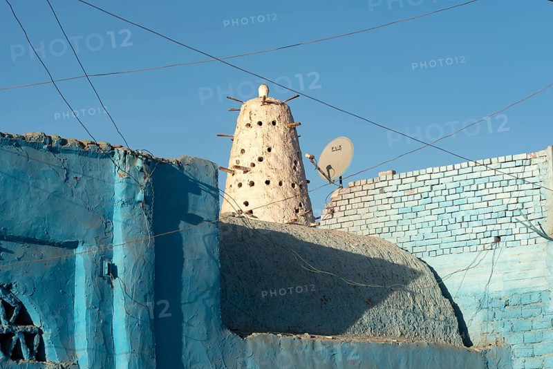 Aswan, Egypt. December 10th 2022 Blue Nubian architecture and traditional style Dovecote or mud brick Pigeon House used to raise and farm pigeons, popular in Egyptian cuisine, village life on the Nile, Aswan, Egypt