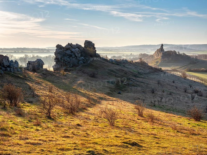 Rock formations in the Teufelsmauer nature reserve in morning light and morning fog, near Weddersleben, Harz, Saxony-Anhalt, Germany
