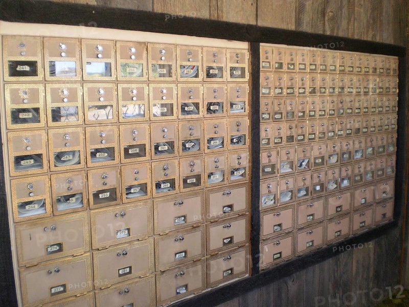Interior view of many mailboxes in a post office building with wooden surroundings, Henrieville Post Office, Bryce Canyon National Park, Utah, USA