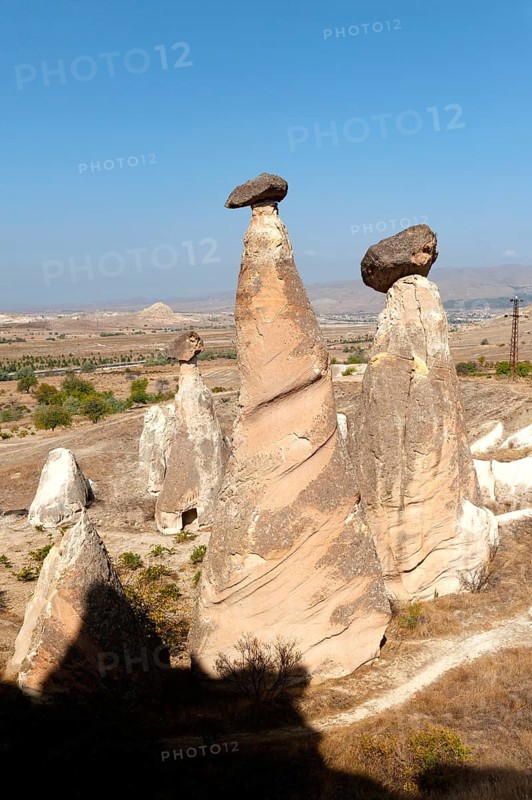 Beautiful morning light on the fairy chimney rock formations known as the Three Graces, part of the dramatic Anatolian landscape of Cappadocia in central, Turkey