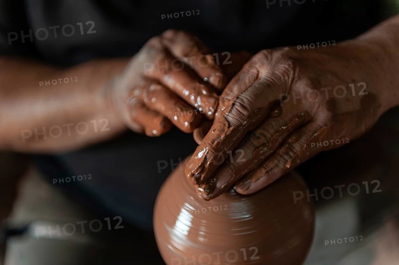 Potter at work making traditional local clay pottery in the Turkish town of Avanos on the river Kizilirmak in Cappadocia, Turkey