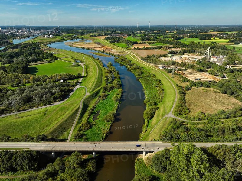 Haltern-Marl, North Rhine-Westphalia, Germany - Lippe, flood protection in the Haltern-Lippramsdorf-Marl area (HaLiMa) . Flood protection on the River Lippe by relocating the dyke and thus extending the floodplain. View downstream In front: Lippramsdorfer Straße bridge On the right: excavation site of the former Auguste Victoria colliery's Shaft 8. Marl Chemical Park at the back