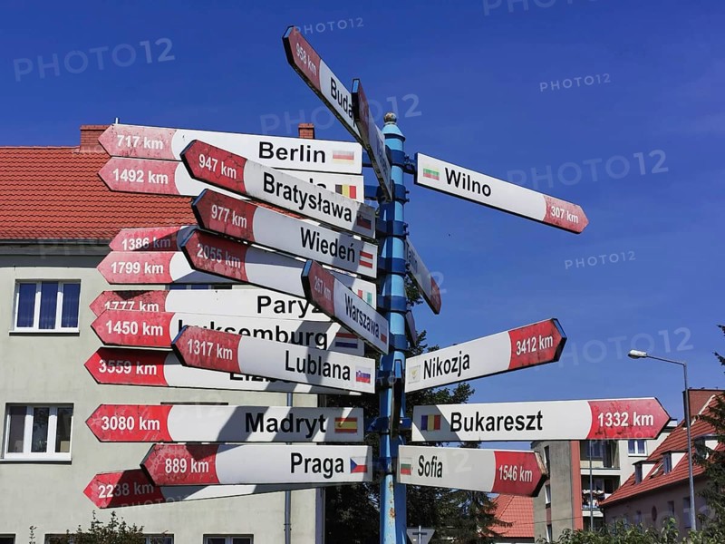 A signpost shows the distances to various European capitals, Gizycko, Masuria, Poland