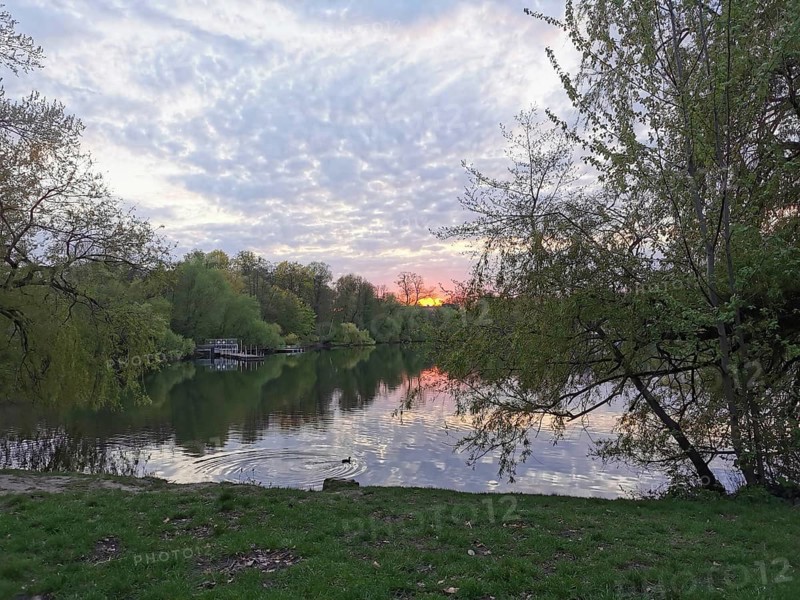 Sunset at Weissensee in Berlin with reflecting water, Pankow, Berlin