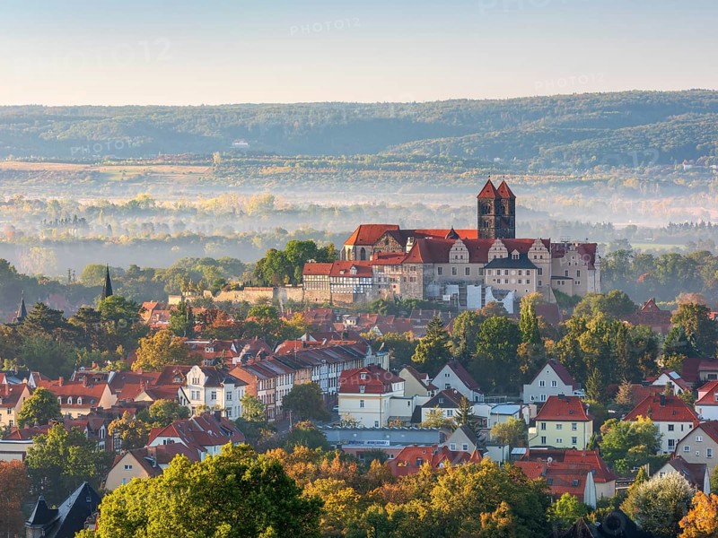 View of Schlossberg with St. Servatius Collegiate Church in morning light and fog in autumn, UNESCO World Heritage Site, Quedlinburg, Saxony-Anhalt, Germany