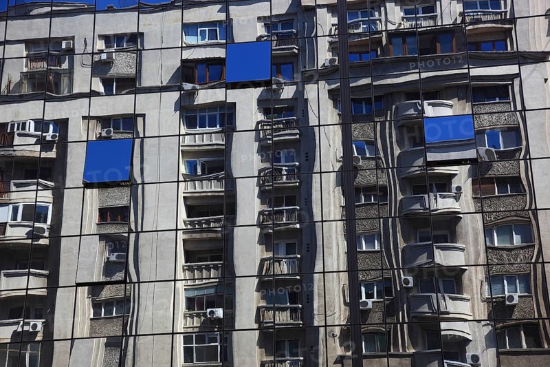 Romania, capital city Bucharest, Bucuresti, reflection in a glass façade