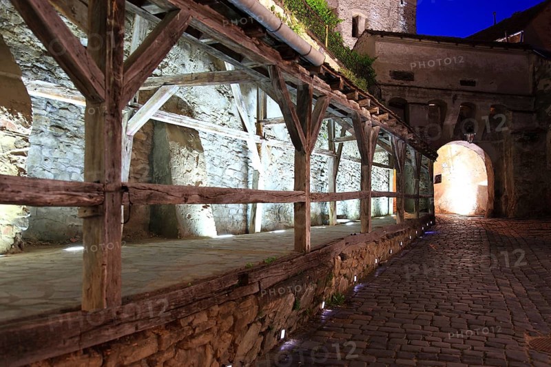 Romania, the way through the hour tower at blue hour in the historic old town of Sighisoara, German Sighisoara, town in Mures district in Transylvania, UNESCO World Heritage Site