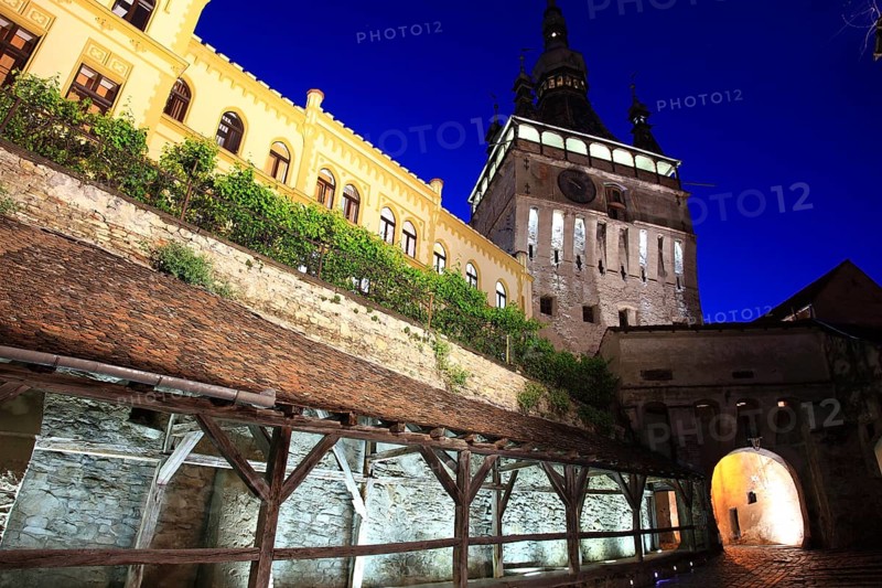 Romania, the hour tower at the blue hour in the historic old town of Sighisoara, German Sighisoara, town in Mures district in Transylvania, UNESCO World Heritage Site