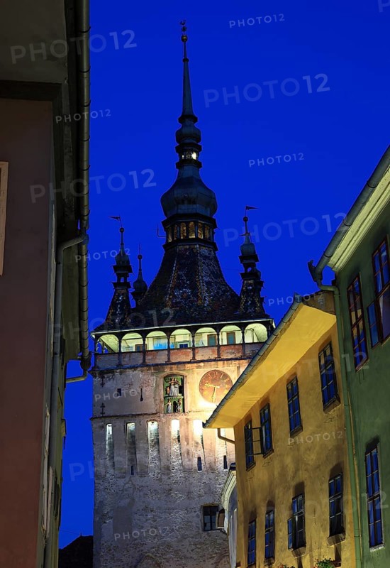 Romania, hour tower at the blue hour in the historic old town of Sighisoara, German Sighisoara, town in Mures district in Transylvania, UNESCO World Heritage Site