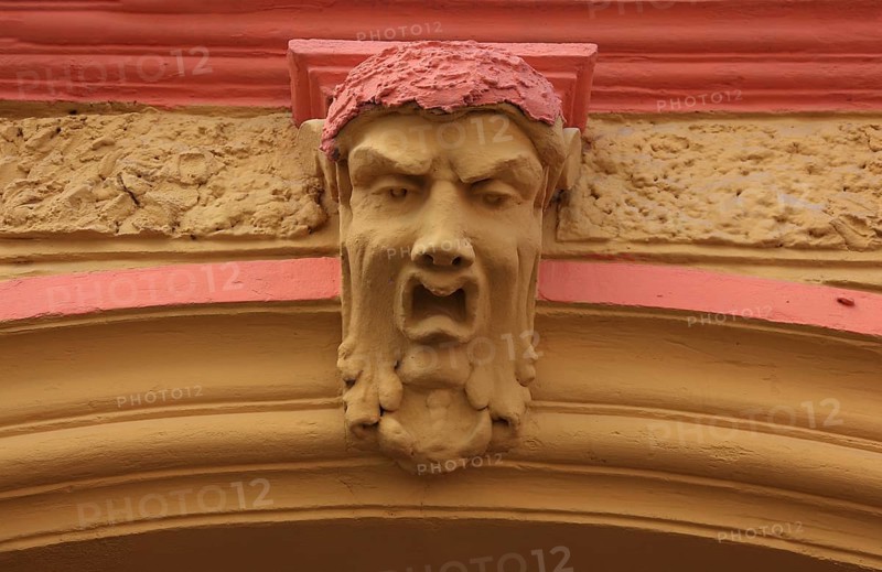 Romania, face above a house entrance in the historic old town of Sighisoara, German Sighisoara, town in Mures district in Transylvania, UNESCO World Heritage Site