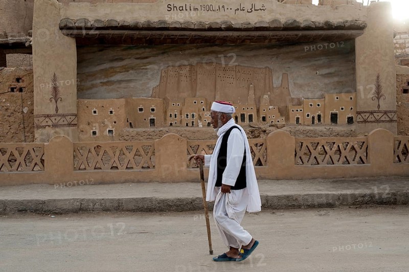 Siwa, Egypt. March 11th 2018 A local Siwian man wearing traditional clothes walking in the streets of Siwa Oasis, an urban oasis in Egypt situated between the Qattara Depression and the Great Sand Sea in the Western Desert