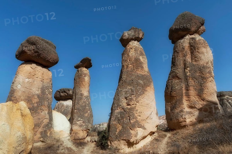 Soft morning light on the fairy chimney rock formations of the dramatic Anatolian landscape of Cappadocia in central, Turkey