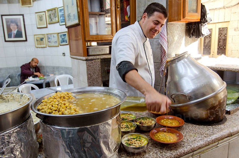 Amman, Jordan. December 12th 2012 Hashem Restaurant, downtown Amman, Jordan. Fuul, Falafel and Hummus being prepared at the legendary eatery