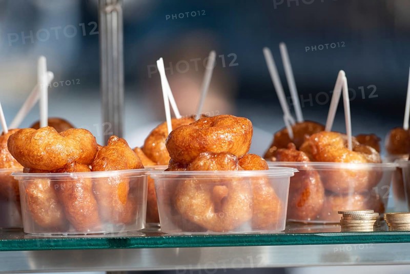 Lokma, traditional deep fried Turkish dessert, street food for sale all over Turkey but the sweet made of syrup and dough is famous in Izmir