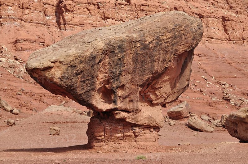 Large single rock in a unique shape in a red rocky landscape, Grand Canyon National Park, Arizona, USA
