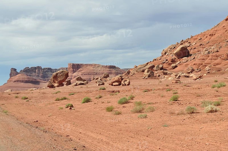 Barren desert landscape with red rock formations and sparse vegetation, Grand Canyon National Park, Arizona, USA