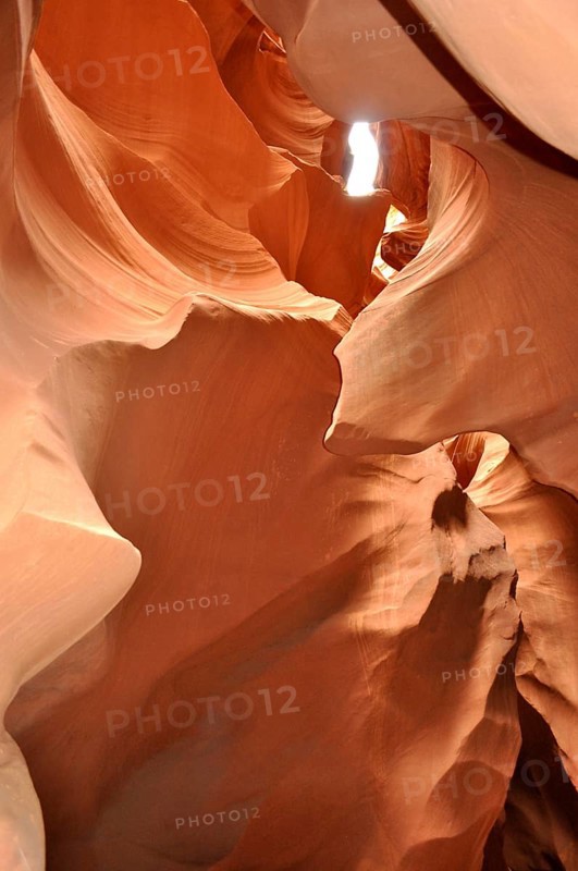 Light transmission through narrow openings in the curved sandstone canyons of a sandstone canyon, Antelope Canyon, Navajo Nation Reservation, Lake Powell Tribal Park, Arizona, USA