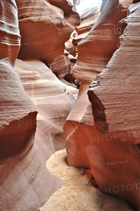 Earthy layers in a sandstone canyon that have formed narrow paths due to erosion, Antelope Canyon, Navajo Nation Reservation, Lake Powell Tribal Park, Arizona, USA