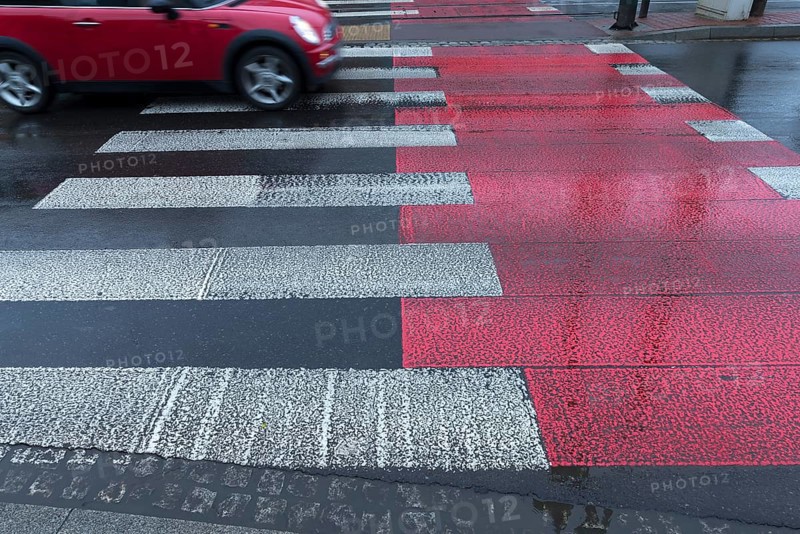 Rain-wet white red zebra stripes, Krakow, Poland