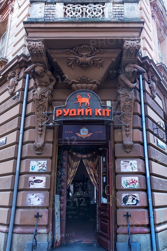 Entrance with atlases, 19th century tenement house, today Café, Lemberg, Ukraine