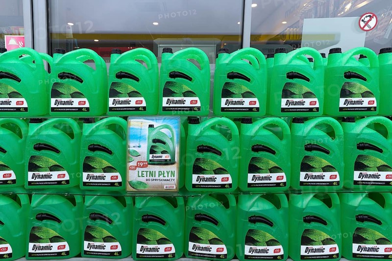 Canister with cleaning water at a gas station, Krakow, Poland