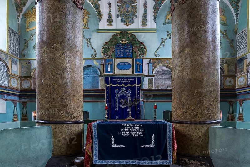 Columns of the central bima, a parish in the back, curtain in front of the Torah shrine, synagogue in Lancut formerly Landshut, Poland