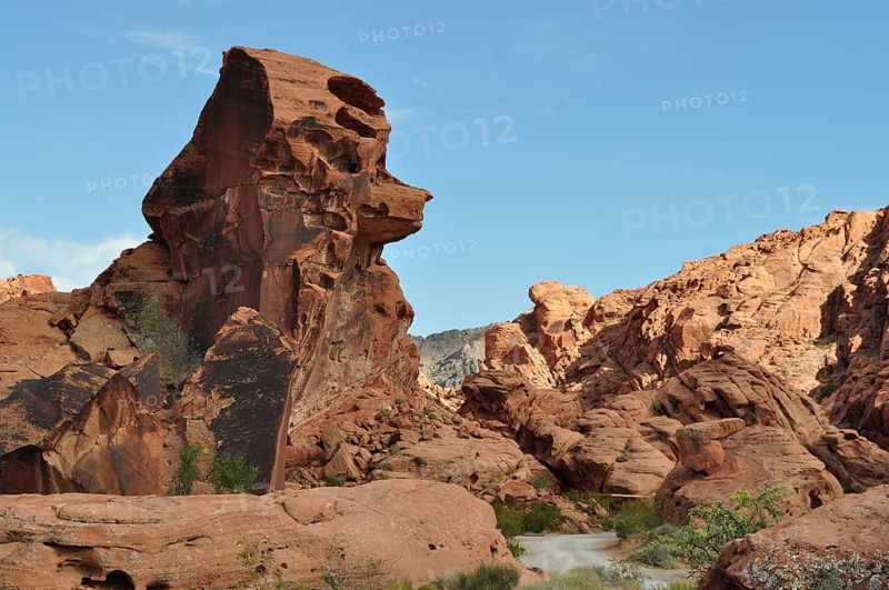 Large red sandstone rock formation in the desert with clear sky in the background, Valley of Fire State Park, Nevada, USA