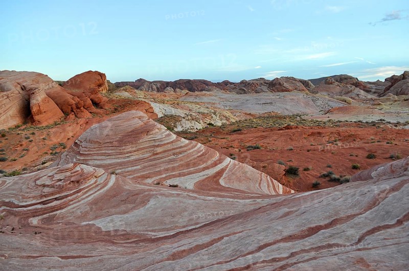 Rock formations with distinctive red and white stripes under a blue sky, Valley of Fire State Park, Nevada, USA
