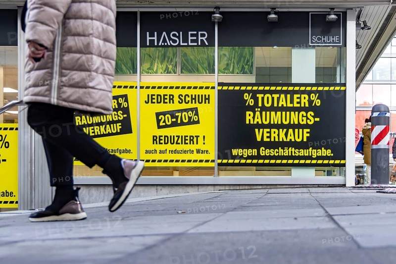 Clearance sale in the city center. A shoe store offers discounts on sales. Stuttgart, Baden-Württemberg, Germany