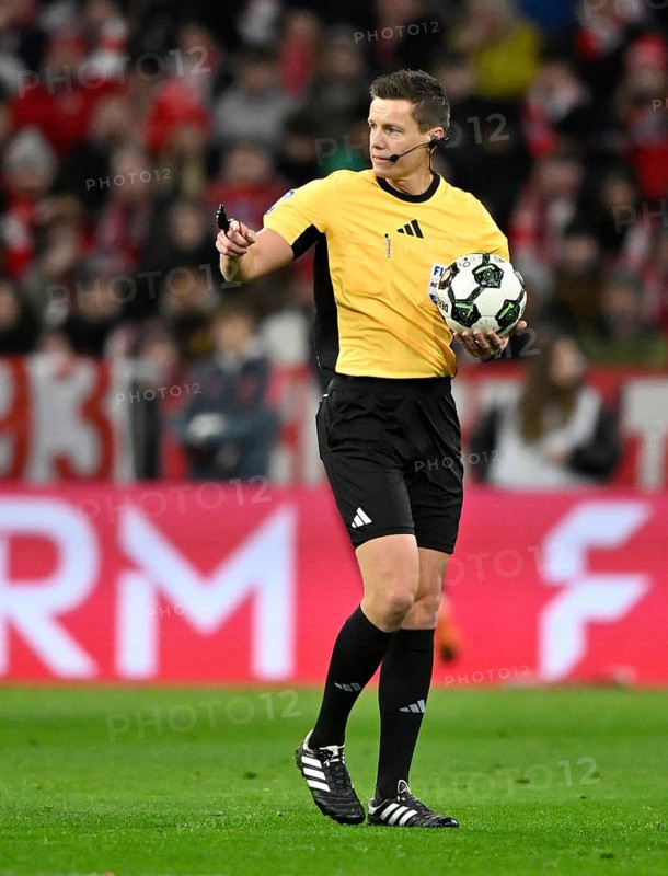 Referee Daniel Siebert with match ball gesture soccer Bundesliga, DFB-Pokal, Allianz Arena, Munich, Bayern, Germany