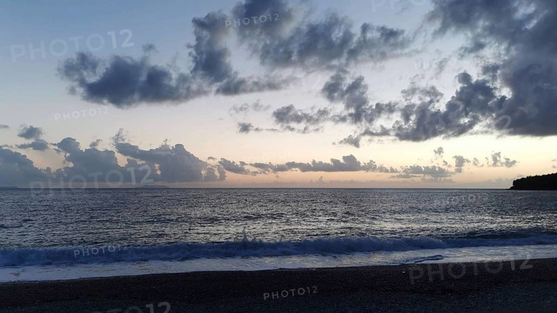 Tranquil seascape at sunset with cloudy sky, Himare, Albanian Riviera