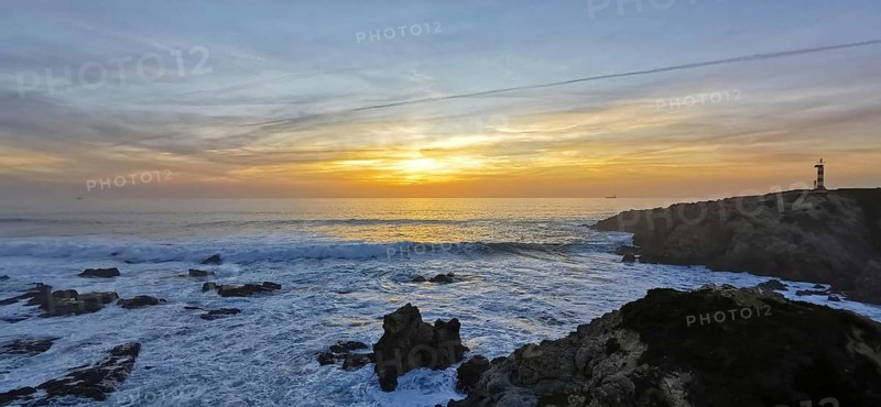 A lighthouse watches over the turbulent sea at sunset, the waves hit the rocks, hike the Fisherman's Trail, hike the Fisherman's Trail, Southwest Alentejo nature park Park and Vicentina Coast, Portugal, Portugal
