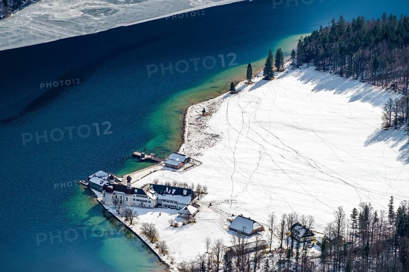 View from above of the snow-covered pilgrimage church of St. Bartholomä am Königssee, Berchtesgaden National Park, Schönau am Königssee, Berchtesgadener Land, Upper Bavaria, Germany