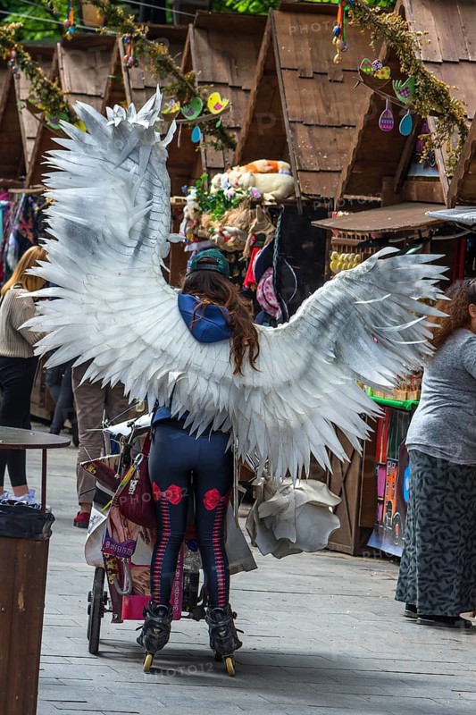 Promotional campaign with an angel costume on Svoboda Prospekt, Lviv, Ukraine