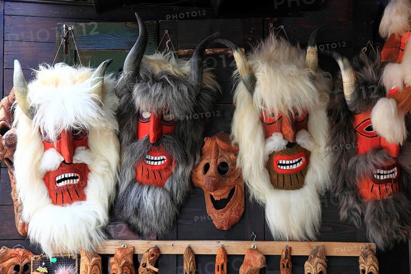 Souvenir sale at Bran Castle, masks made from natural materials such as wood, sheepskin or goatskin and often with real animal horns, Törzburg, in Transylvania, Romania. It is famous as Dracula's Castle and one of the country's main attractions