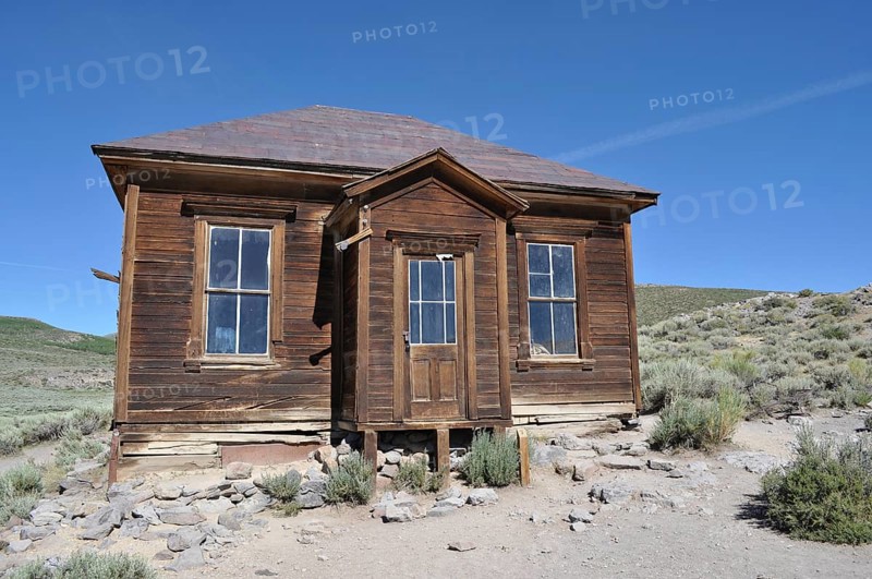 Ruined wooden house in a ghost town surrounded by arid countryside, Bodie Ghost Town, California, USA