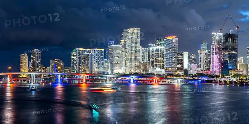 Miami skyline with high-rise real estate in downtown panoramic ocean view at night in Miami, USA