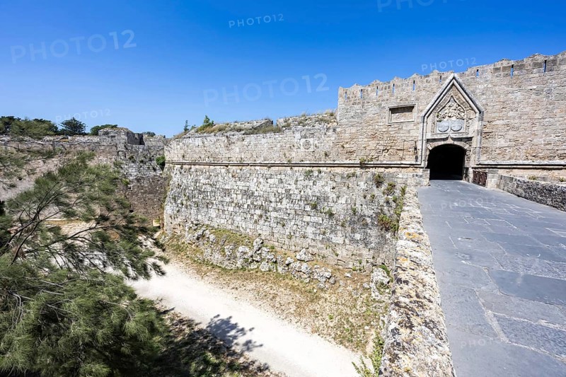 Red gate from the Middle Ages in the city wall of the historic old town on the island of Rhodes, Greece