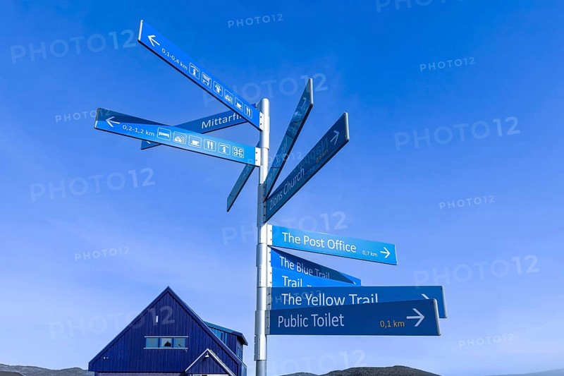 Greenland Ilulissat signs that show location of Ilulissat city and services