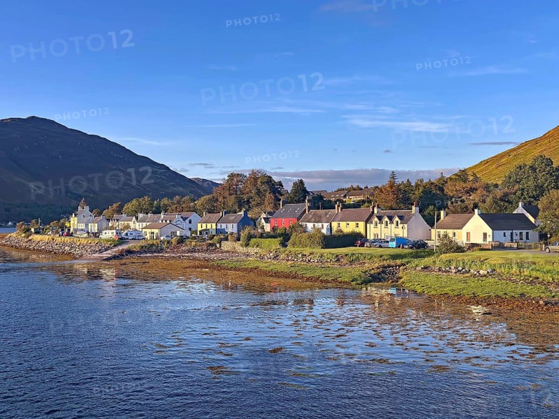 Small coastal village with views of the sea and surrounding mountains, Dornie, Eilean Donan Castle, Scotland, Great Britain