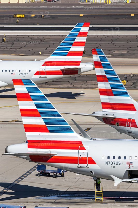 Boeing and Airbus aircraft tail units of American Airlines with the license plate N737US at Phoenix airport, USA