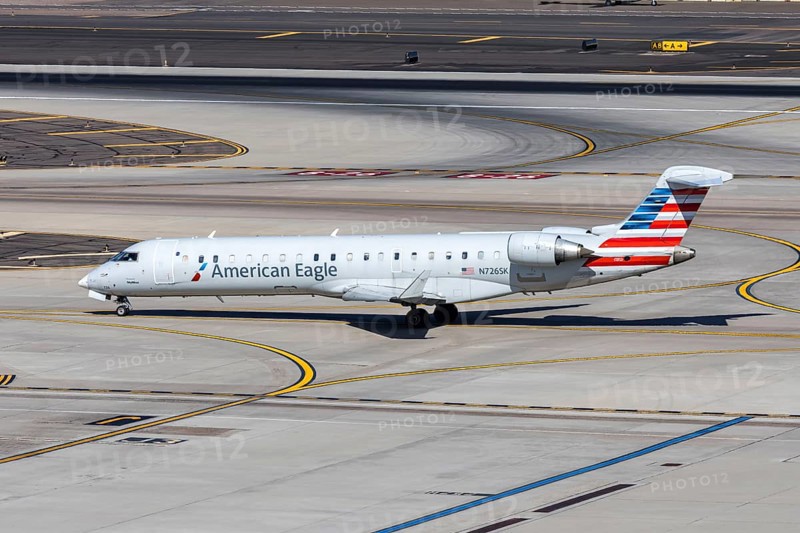 A Bombardier CRJ-700 from American Eagle operated by SkyWest Airlines with license plate N726SK at Phoenix airport, USA