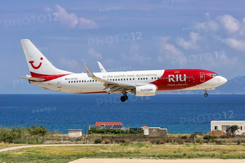 A TUI Boeing 737-800 aircraft with the D-ATUZ license plate and RIU Hotels & Resorts special livery at Rhodes Airport, Greece
